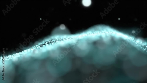 Abstract flowing particles against black background suitable for technology concepts