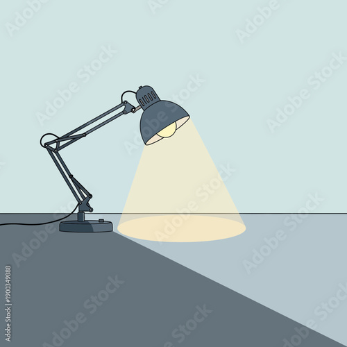 Adjustable desk lamp casting light and shadow on a surface