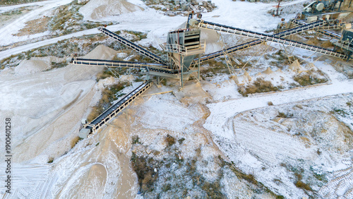 Fotografi Wide aerial drone perspective of an active mining quarry facility in winter