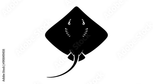 Black stingray fish swimming alone underwater.