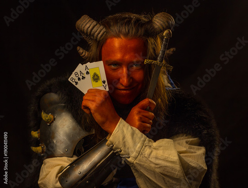 Obraz na plátně Tiefling rogue with dagger and cards