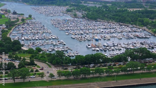 Wallpaper Mural Aerial view of Chicago Illinois marina densely filled with boats, green park areas and surrounding roads, summer daylight, detailed urban waterfront infrastructure. Torontodigital.ca