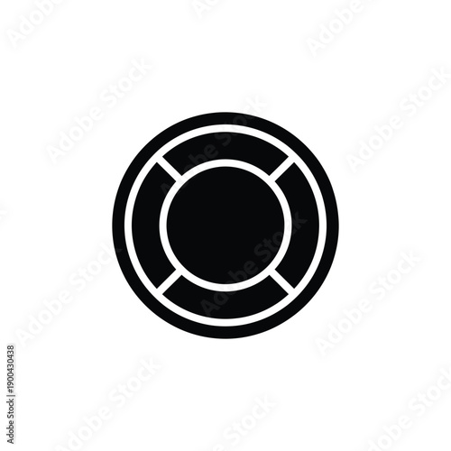 A black and white circular object with a divided outer ring and solid center