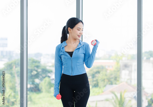 Asian sporty young beautiful happy smiling strong woman active sport in sportswear exercise with pink dumbbells weights while standing athlete training in bright fitness gym healthy wellness lifestyle Free Download Asian sporty young beautiful happy smiling strong woman active sport in sportswear exercise with pink dumbbells weights while standing athlete training in bright fitness gym healthy wellness lifestyle - GFXLoad