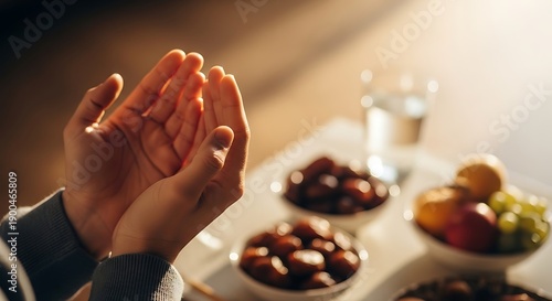 Muslim Person Making Dua Before Iftar with Dates and Water - Ramadan Fasting and Prayer Concept