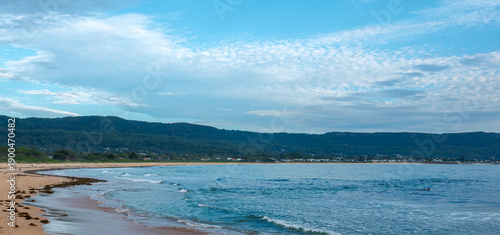 People enjoy beach walks, ocean boating, and coastal leisure on Australia Day at Bellambi Beach, NSW, Australia, January 26, 2024