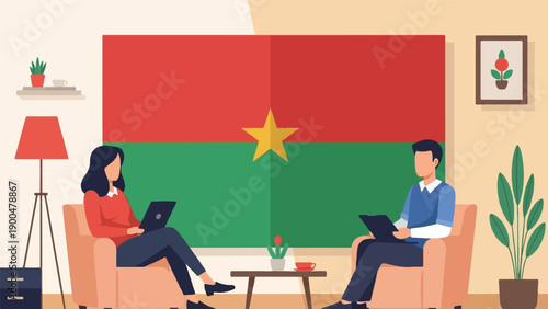 People using laptops in a living room with a national flag