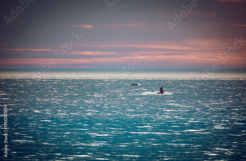 People enjoy beach walks, ocean boating, and coastal leisure on Australia Day at Bellambi Beach, NSW, Australia, January 26, 2024