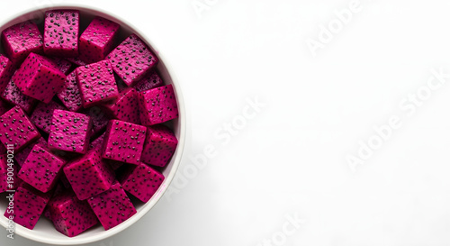 Vibrant Bowl of Diced Dragon Fruit Cubes on a White Background, Offering a Refreshing and Exotic Culinary Experience