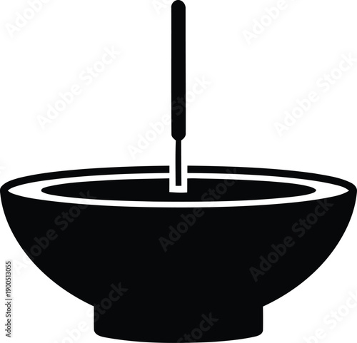 Black bowl with white rim and pestle
