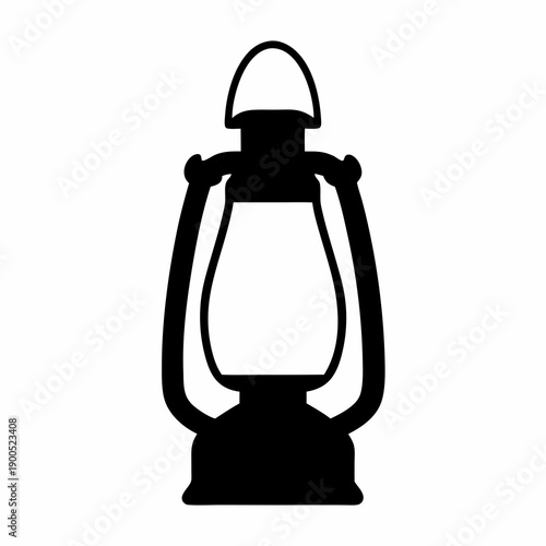 Monochrome silhouette of a vintage kerosene lantern shining in the darkness