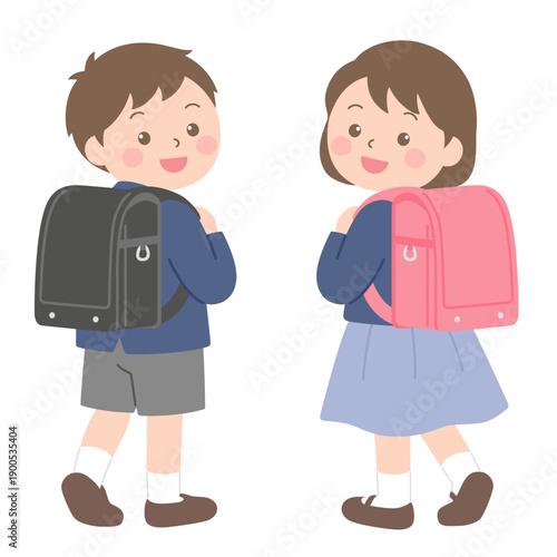 ランドセルを背負って振り向く新一年生の男女の子と女の子のイラスト