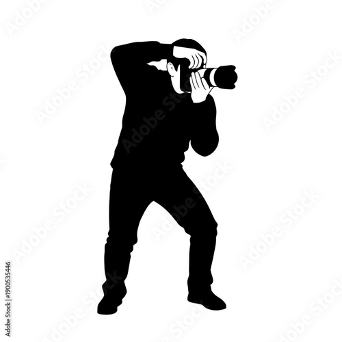 Silhouette of a photographer taking a photo with a professional camera