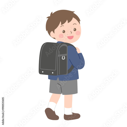 ランドセルを背負って振り向く新一年生の男の子のイラスト