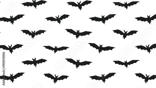 Classic black and white seamless pattern of flying bats creates a spooky, eerie atmosphere for Halloween designs.