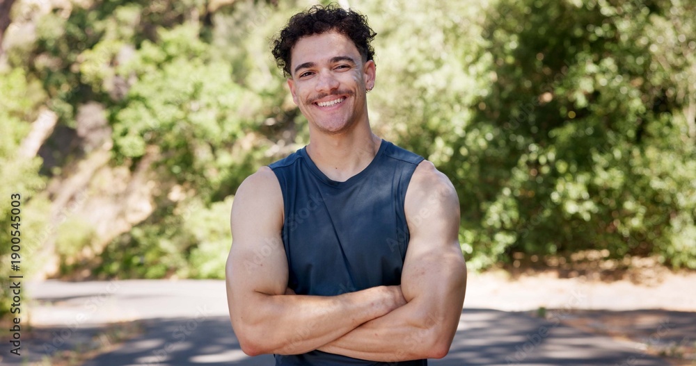 Fototapeta premium Portrait, fitness and happy man in street, arms crossed and confidence with nature. Outdoor, runner and person with pride, wellness and commitment to training routine, health benefits and exercise