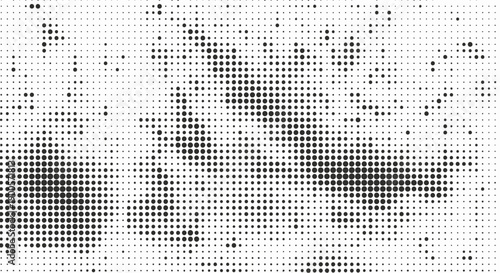 A black and white abstract pattern composed of numerous small dots of varying density.