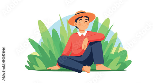 Man sitting in grass wearing hat, relaxed pose