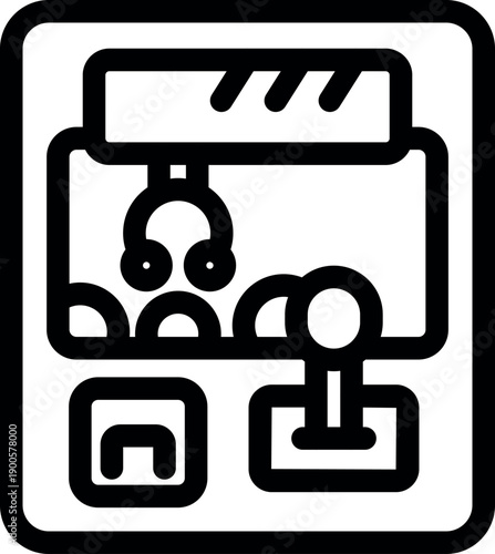 Claw crane arcade game picking up a prize, featuring a joystick and coin slot, offering entertainment and challenge