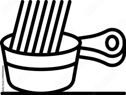 Freshly cooked spaghetti is being drained in a handled strainer, ready to be served