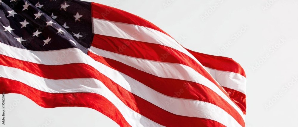 Obraz premium National Flag with Stars and Stripes Waving Outdoors in Bright Daylight for Patriotic Celebration and Independence Day Background with Copy Space