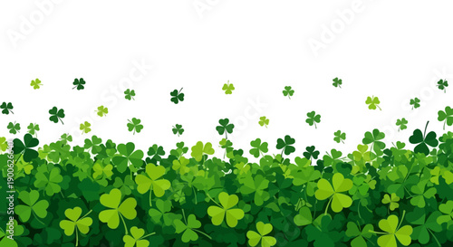 A vibrant green field filled with lush clover and shamrocks under a white background.
