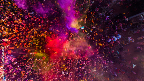 Nandgaon, India - 01 March 2025 Aerial view of people celebrating the holy colour festival at Shri Krishna Temple, Uttar Pradesh, India.