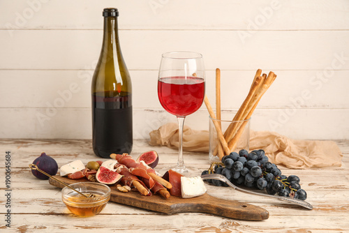Board with tasty jamon slic...