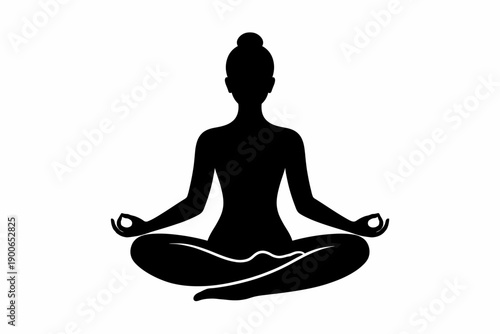 Silhouette of female in lotus pose practicing meditation