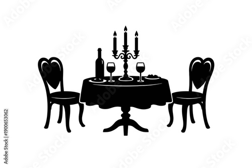 Silhouette of romantic dining setup with candlelit table and chairs