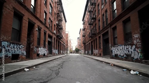 Abandoned urban street with graffiti covered buildings