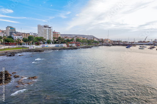 Aerial view of Ilo Port at sunset with ships and industrial piers, Moquegua, Peru