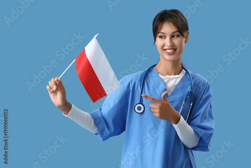 Female doctor pointing at flag of Poland on blue background