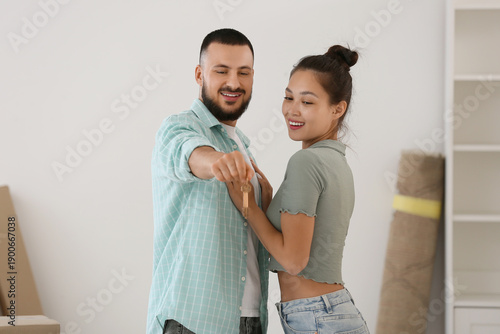 Young couple with key from ...