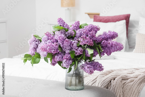 Vase with lilac flowers on ...