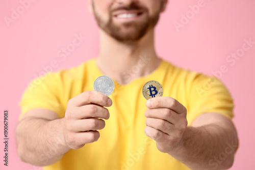 Young man with bitcoins on ...