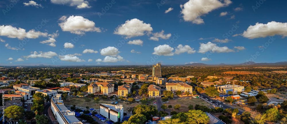 Obraz premium Aerial panoramic view of Gaborone city, capital of Botswana at sunset, modern architecture, office buildings