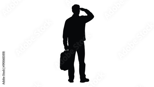 Silhouette of a man shielding his eyes while holding a briefcase