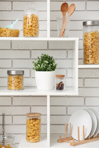 Jars and bowl with raw past...