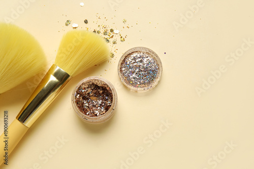 Makeup brushes and jars of ...