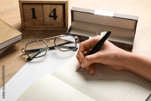Woman writing something in ...