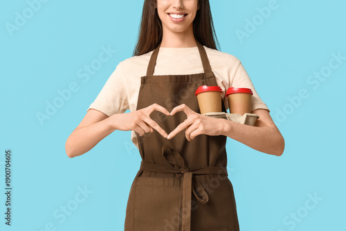 Young female barista with c...