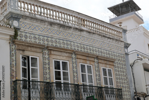 Historic facade with tiles in the Portuguese town of Tavira, Algarve, Portugal