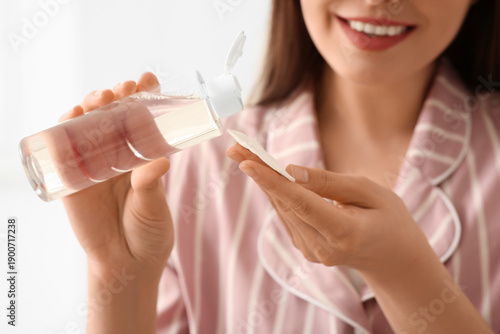 Young woman in pajamas with...