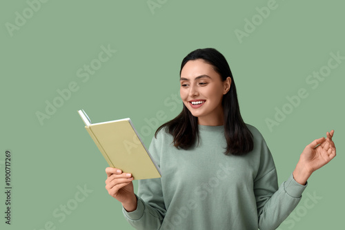 Young pretty woman reading ...