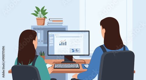 Two women looking at a computer screen displaying business data and analytics in an office