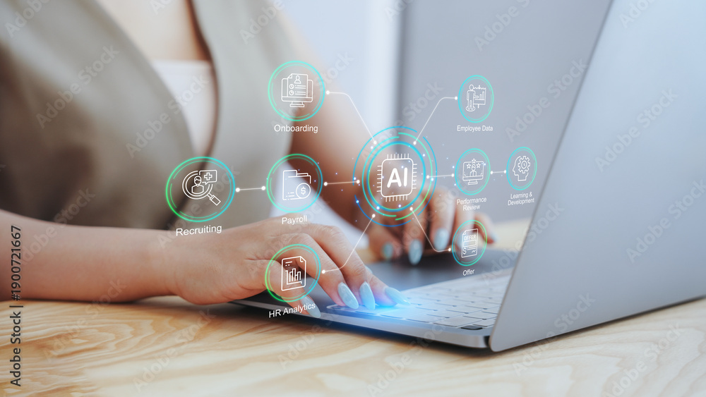 © Tanakorn - Businesswoman using laptop with virtual AI human resources dashboard and workflow icons. Concept of HR automation, smart recruiting strategy, digital employee management, and workforce analytics. © Tanakorn - Businesswoman using laptop with virtual AI human resources dashboard and workflow icons. Concept of HR automation, smart recruiting strategy, digital employee management, and workforce analytics.