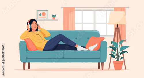 Person relaxing on couch listening to music with headphones