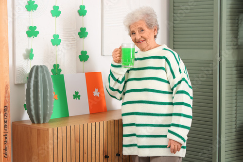 Senior woman with mug of gr...
