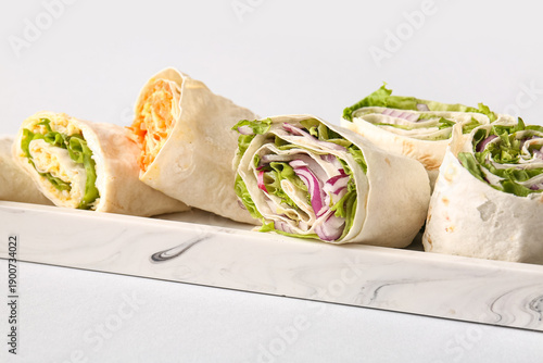 Plate of tasty lavash rolls...